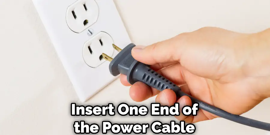 Insert One End of the Power Cable