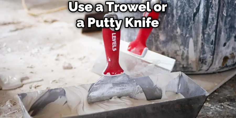 Use a Trowel or a Putty Knife