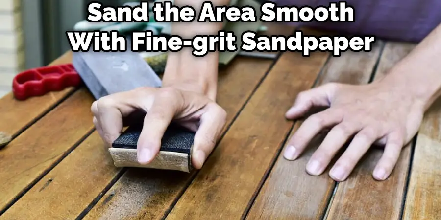 Sand the Area Smooth With Fine-grit Sandpaper